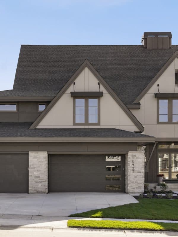 Modern two-story home with three-car garage and stone accents