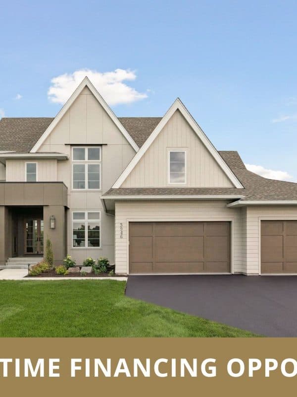 Modern suburban home with three-car garage and financing banner