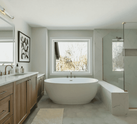Modern bathroom with freestanding tub, wood vanity, and glass shower