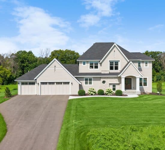 Front exterior of a two-story custom home with three-car garage