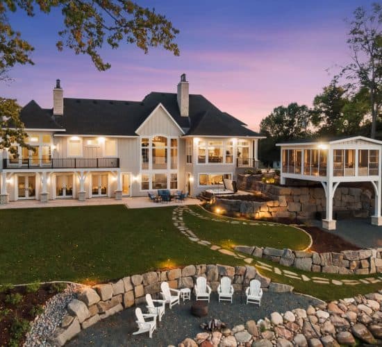 Luxury lakeside home with terraced yard and fire pit