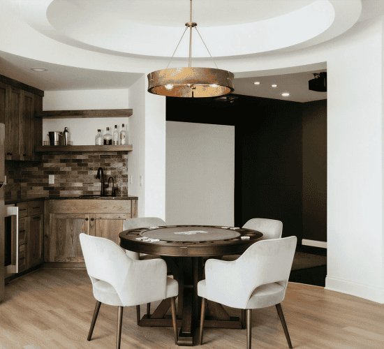 Modern kitchen game room with poker table and bar