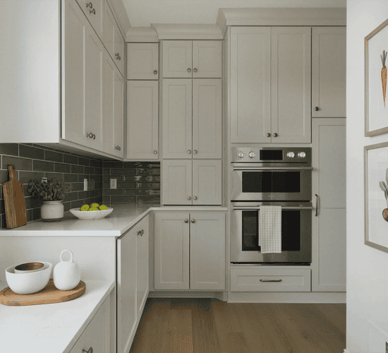 White scullery with tall cabinetry and double wall oven