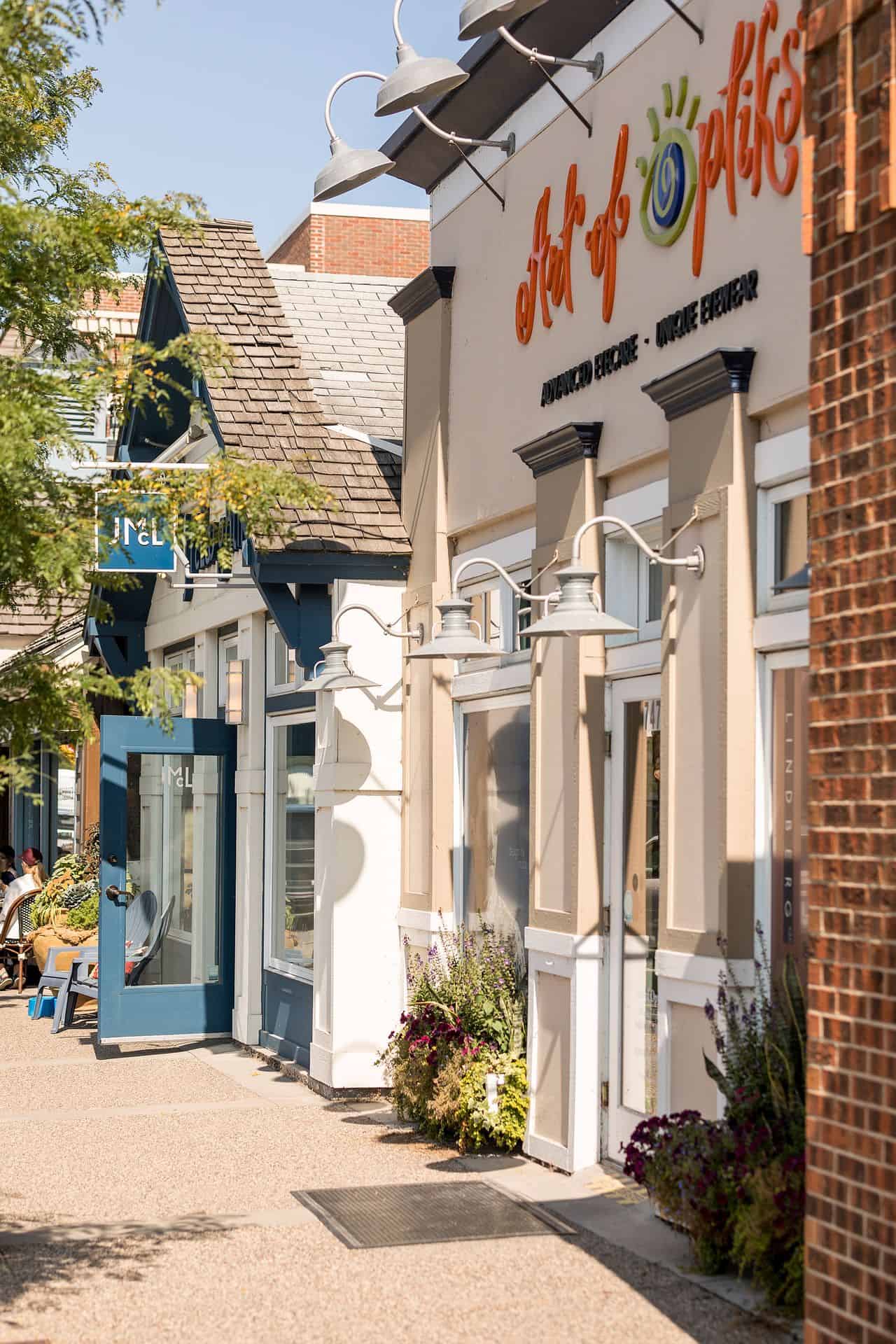 Art of Pilates studio storefront on sunny sidewalk